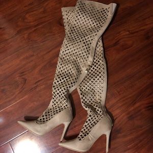 Knee high, cut out heels. Never worn